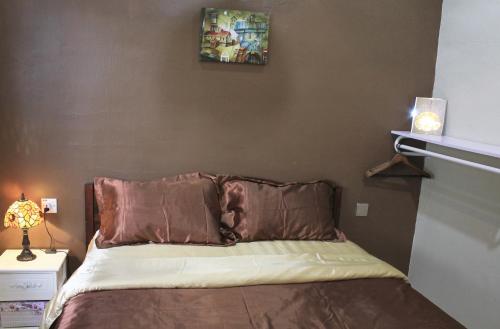 Postel nebo postele na pokoji v ubytování Memory Homestay