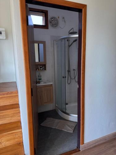 a bathroom with a shower with a glass door at Pai Chao Kha in Pai
