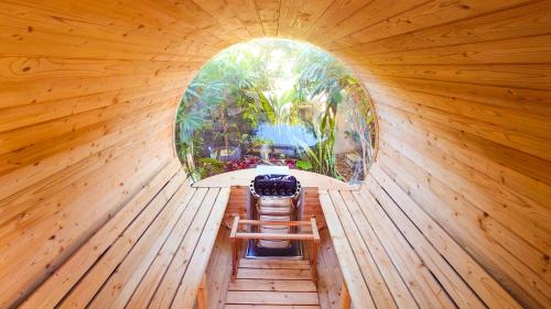 an inside view of a sauna with a circular window at サンメール座間味アネックス in Zamami