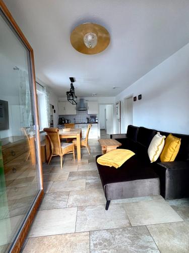 a living room with a couch and a table at Haus Luna - Apartments in Schwangau