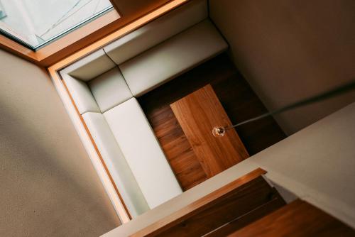 a wooden door in a room with a window at なごみの寝床 in Nishinoomote
