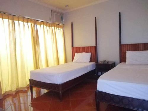Postel nebo postele na pokoji v ubytování DDD Habitat, Inc - Cagayan De Oro