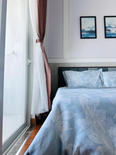 Postel nebo postele na pokoji v ubytování Alpha Homestay Marina Long Xuyên