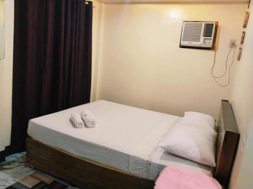 En eller flere senge i et værelse på Blessed Villa El Nido