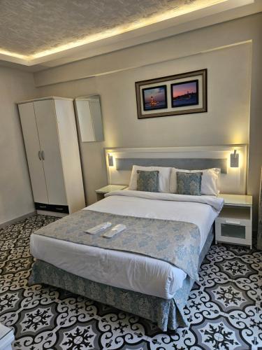 a bedroom with a large bed in a room at Lemon Residence in Istanbul