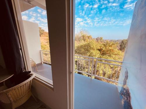 a view from a room with a window at Paradise Woodland Resort Chintpurni in Bharwain
