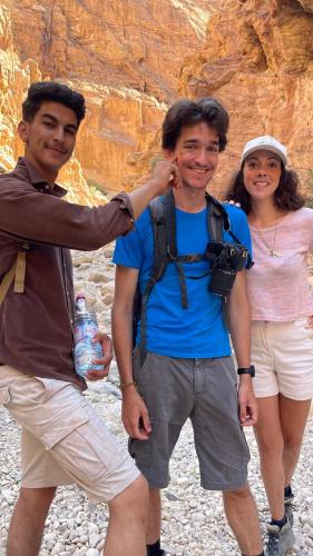 two men and a woman posing for a picture at Dana luxury huts in Dana