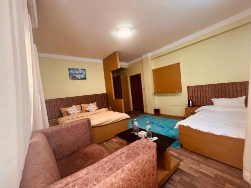 Una cama o camas en una habitación de Chubasha Chautara Restro & Inn