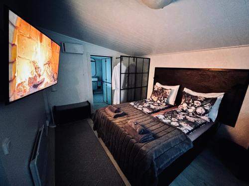 a bedroom with a large bed in a room at Guest house - Northern tealight in Rovaniemi