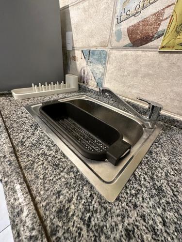 a sink in a counter with a keyboard in it at JRE-EG modern aprt11Sheikh Zayed in Sheikh Zayed