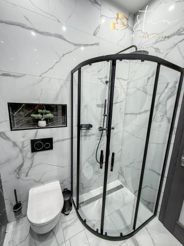 a bathroom with a shower and a toilet at Residence S7 - Luxury living Apartment in Prešov