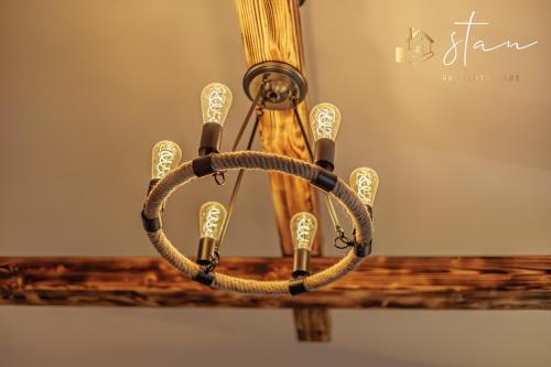 a chandelier hanging from a ceiling at Residence S7 - Luxury living Apartment in Prešov