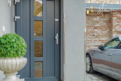 a door with a car parked outside of a building at Residence S7 - Luxury living Apartment in Prešov