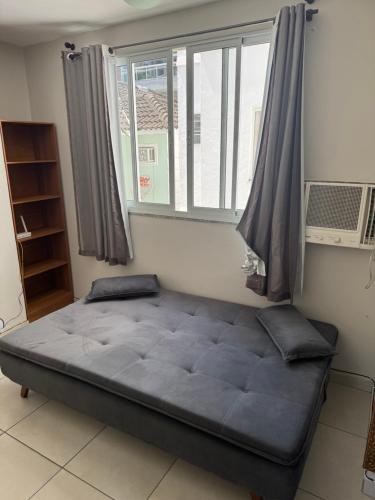 Ένα ή περισσότερα κρεβάτια σε δωμάτιο στο Apartamento Reserva do Sahy