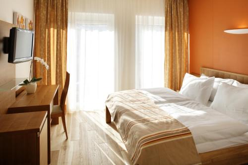 Postel nebo postele na pokoji v ubytování Hotel Lava Inn - 24 h Check-In - Nähe LKH, Landeskrankenhaus, Feldbach