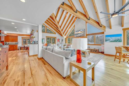 a living room with a couch and a table at Stunning Mountain Gem with Hot Tub Near Palisades in Olympic Valley