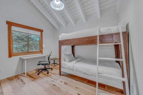 a bedroom with a bunk bed and a desk at Stunning Mountain Gem with Hot Tub Near Palisades in Olympic Valley