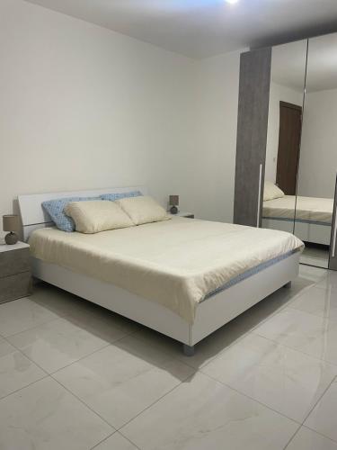 Postel nebo postele na pokoji v ubytování Xlendi Apartments