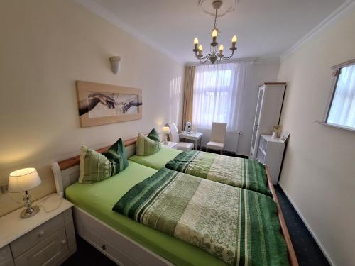 Postel nebo postele na pokoji v ubytování Haus Toskana