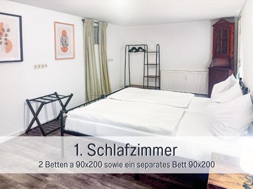 a bedroom with a bed with white sheets at Casa Isabella Lauf, wunderschöne Aussicht - ruhig gelegen - top für Familien und Geschäftsreisen, super ausgestattet in Lauf