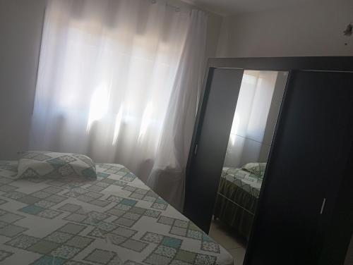 Ένα ή περισσότερα κρεβάτια σε δωμάτιο στο Apartamento das Estrelas