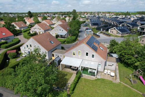 an aerial view of a house in a residential neighborhood at Ferienhaus Fridolin Fort Soleil 27, Breskens Zeeland in Breskens