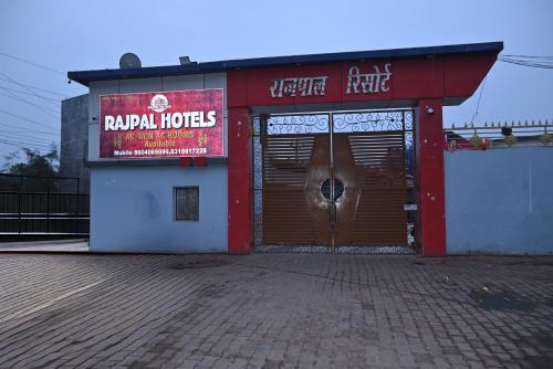 a store with a door with a horse in it at Rajpal Hotels in Orai