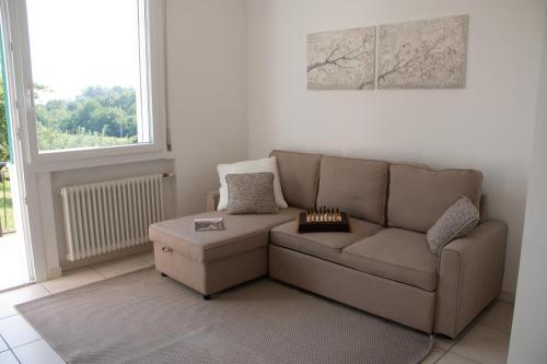 a living room with a couch and a table at Al frutteto in San Pietro di Feletto