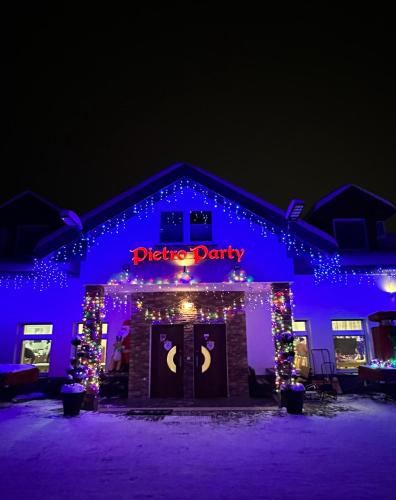 adqdqdqocity lit up at night with christmas lights at Pietro Pokoje B&B Czarna in Czarna