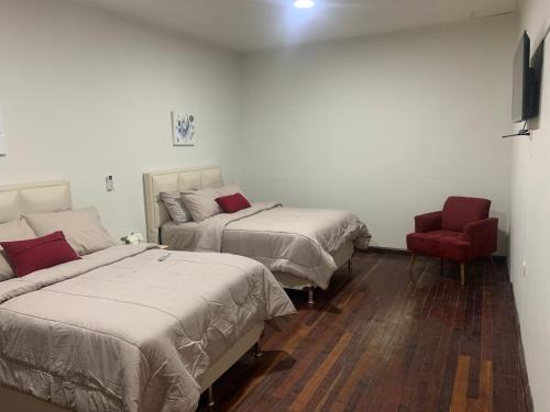 Кровать или кровати в номере Hotel Boutique La Casona