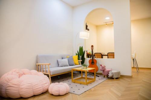 a living room with a couch and a bean bag chair at Skudai Tun Aminah Cozy Home - Sutera Mall 6 mins in Skudai