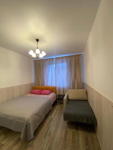 Кровать или кровати в номере Cat Garden Riga Airport Apartments
