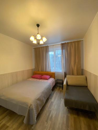 Кровать или кровати в номере Cat Garden Riga Airport Apartments