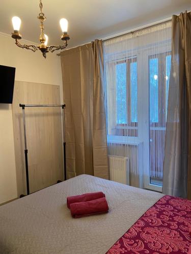 Кровать или кровати в номере Cat Garden Riga Airport Apartments