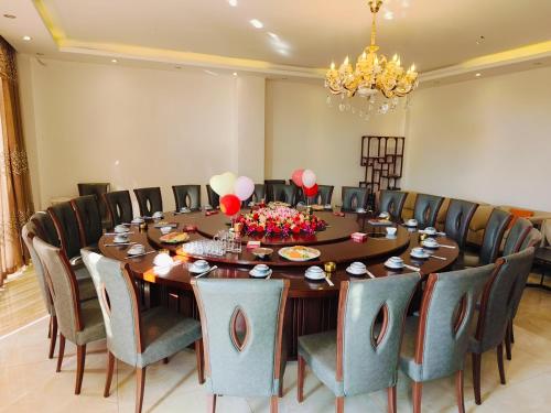 Posezení v ubytování Bai Nian Sheng Shi Hotel