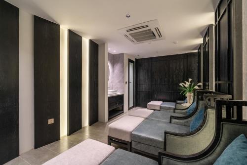 a waiting room with a row of chairs at Luxe Paradise Premium Hotel and Spa in Hanoi