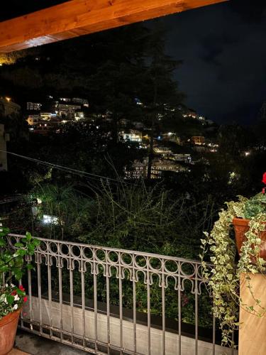 a view of a city at night from a fence at Villa Leonardo in the heart of Positano in Positano