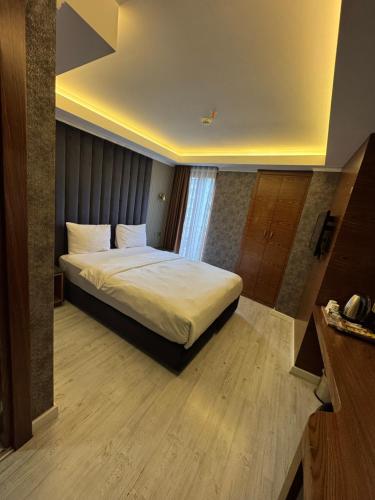 Postel nebo postele na pokoji v ubytování Sultan city hotel