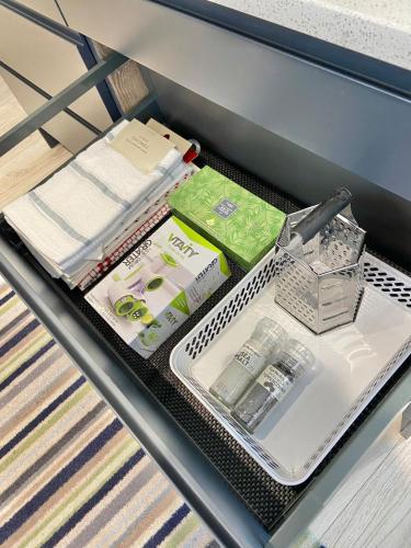 a drawer in a bed with a white drawer organizer at Coastal Gem 10 Mins from Dublin Airport in Donabate