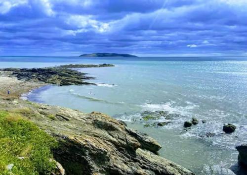 a view of the ocean from a rocky beach at Coastal Gem 10 Mins from Dublin Airport in Donabate
