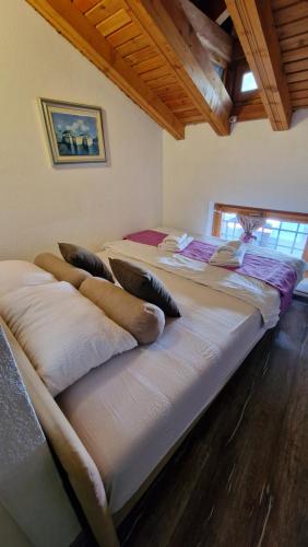 a group of beds sitting in a room at Pansion Oscar Summer Garden in Mostar