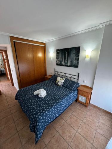 Ένα ή περισσότερα κρεβάτια σε δωμάτιο στο Apartamento Lomas del mar II vera playa