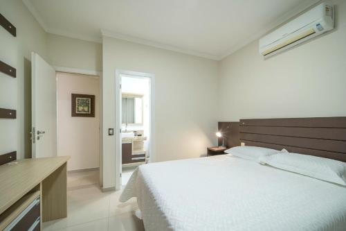 Ένα ή περισσότερα κρεβάτια σε δωμάτιο στο Apartamento Palazzo Em bominhas