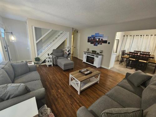 a living room with a couch and a table at Cozy Urban Skies in Minneapolis