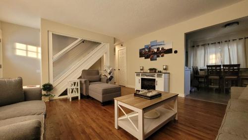 a living room with a couch and a table at Cozy Urban Skies in Minneapolis