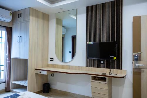 TV a/nebo společenská místnost v ubytování The Executive Inn