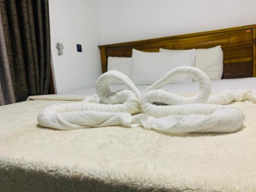 Postel nebo postele na pokoji v ubytování Nethuli Inn Ella