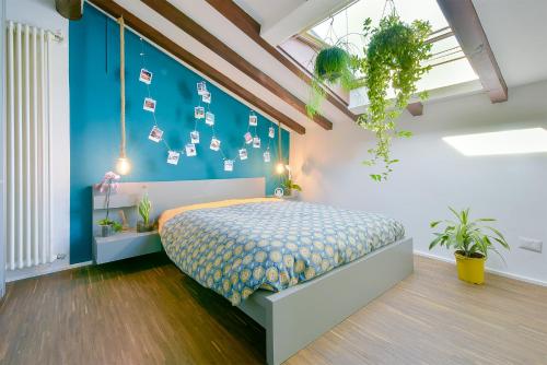 Ένα ή περισσότερα κρεβάτια σε δωμάτιο στο Botanical Apartments Modena