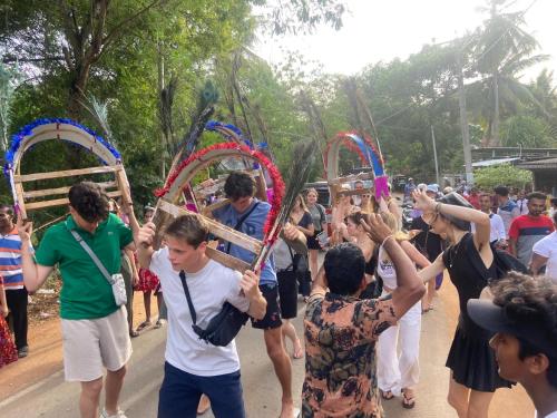 a group of people holding up wooden hoops at Moonshade Handapanagala in Monaragala