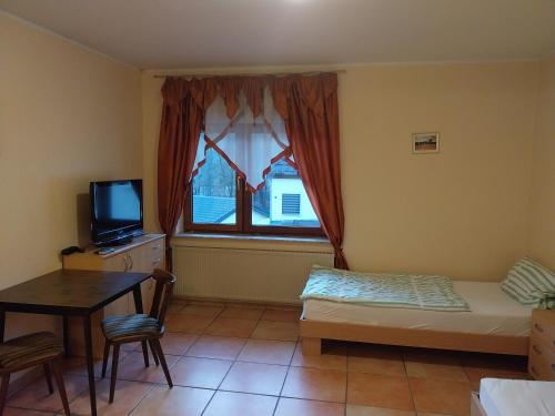 Ένα ή περισσότερα κρεβάτια σε δωμάτιο στο Monteurwohnung Niederhausen